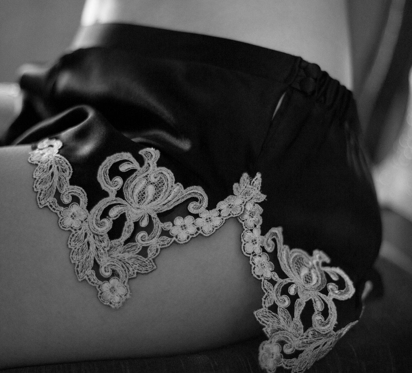 Delicate floral embroidery on black La Perla silk.