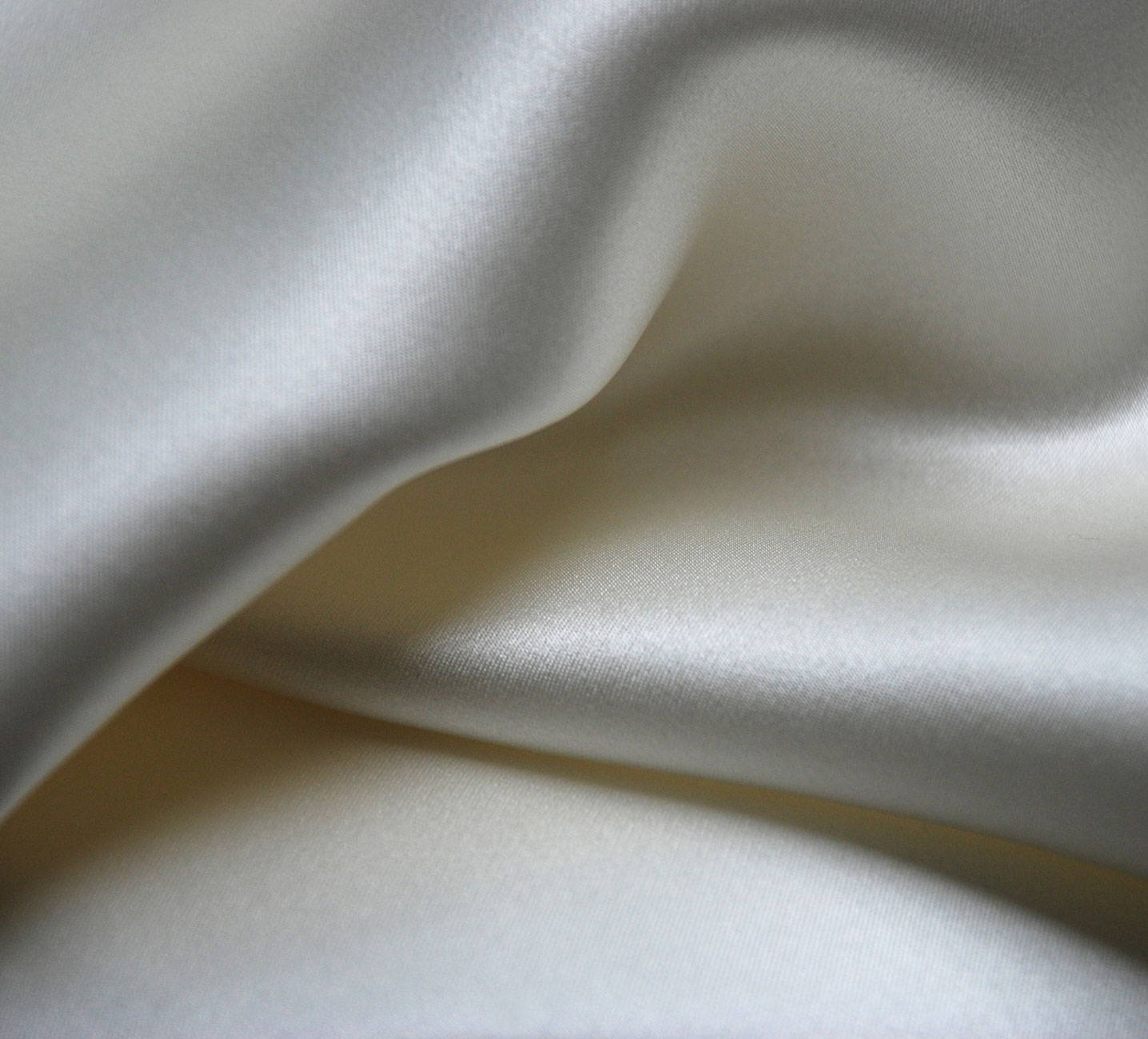 A close study of flowing La Perla silk.